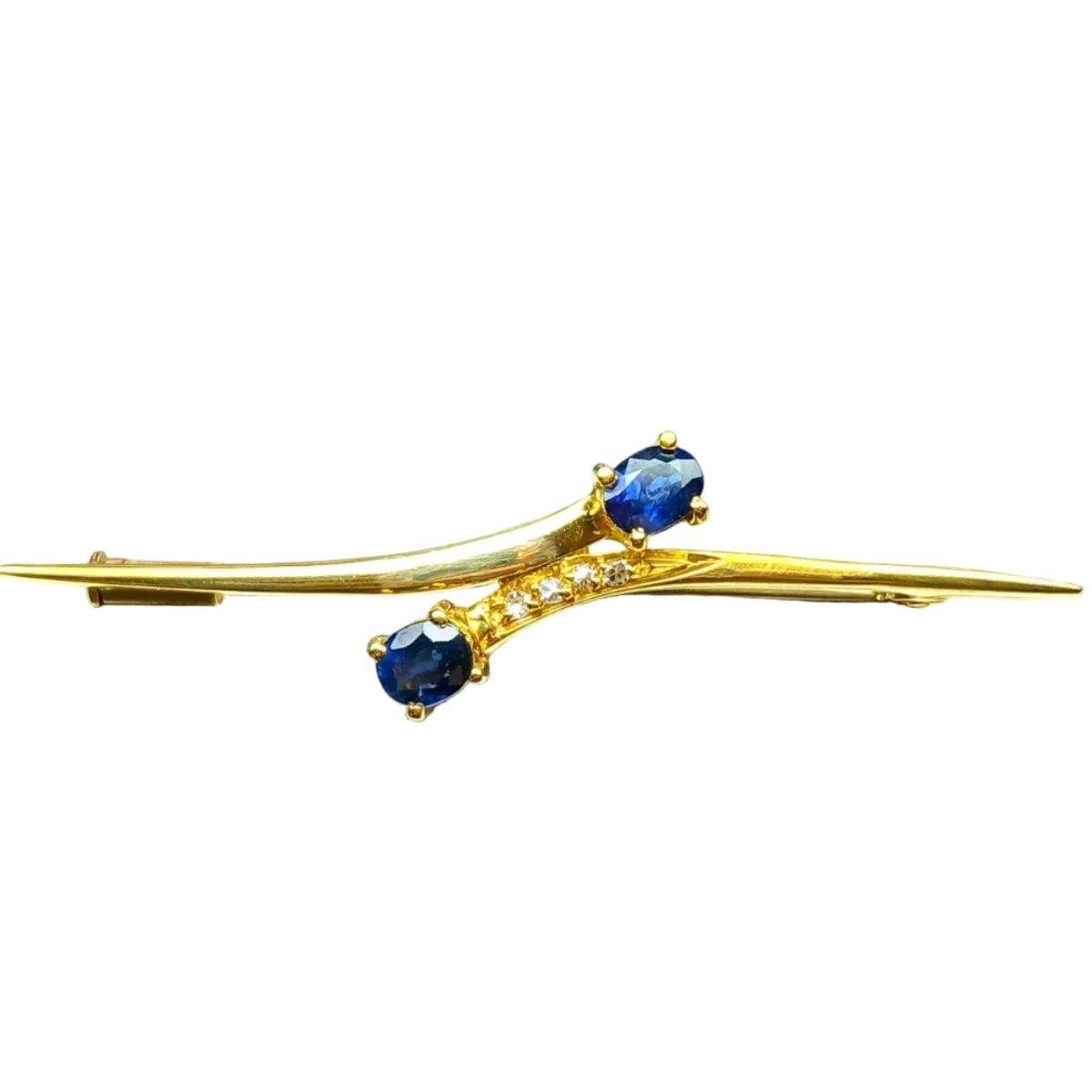 Broche en or jaune, saphirs et diamants - Castafiore
