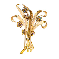 Broche en or rose, or blanc, rubis, saphirs et diamants - Castafiore