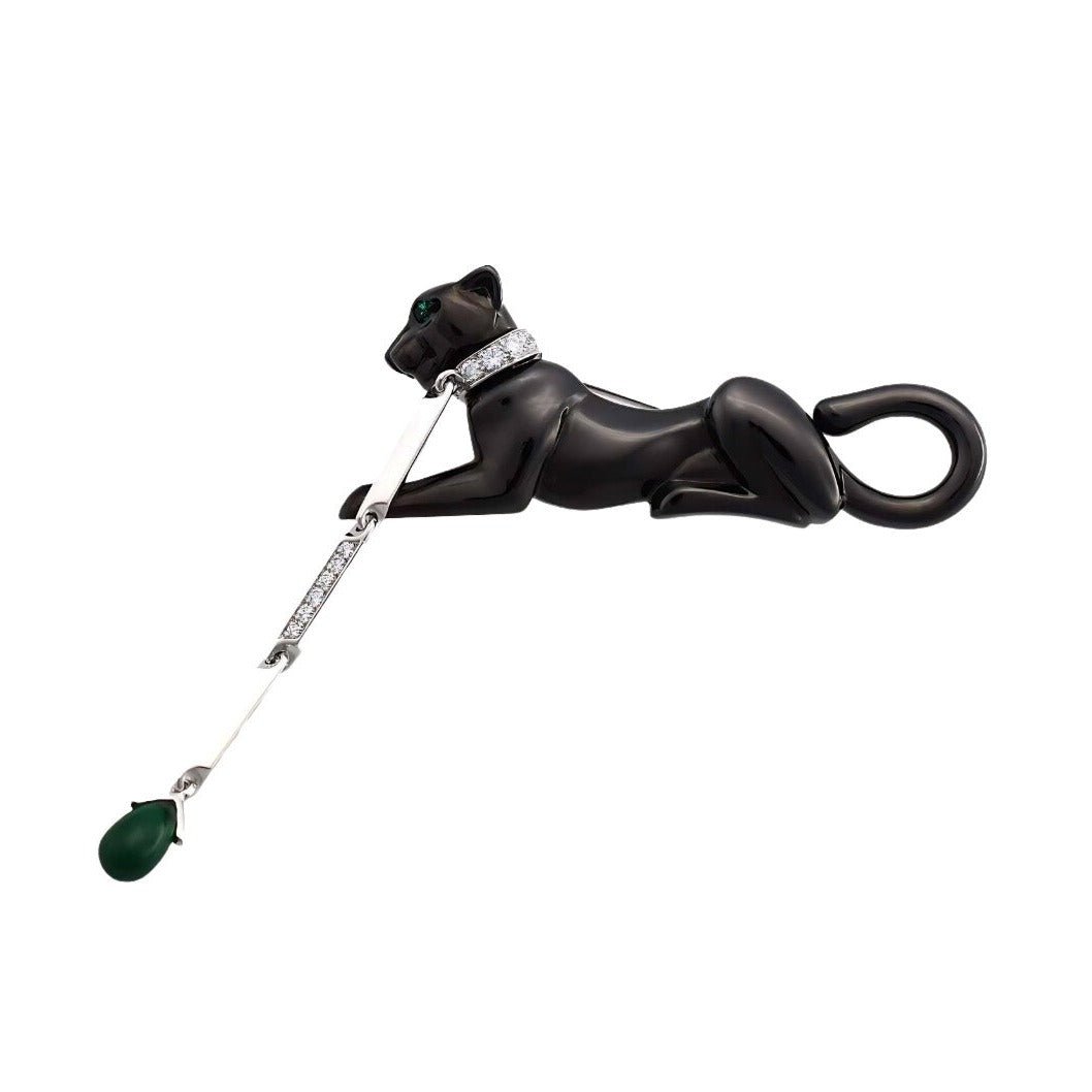 Broche Épingle CARTIER Panthère en or blanc, émeraudes et diamants - Castafiore