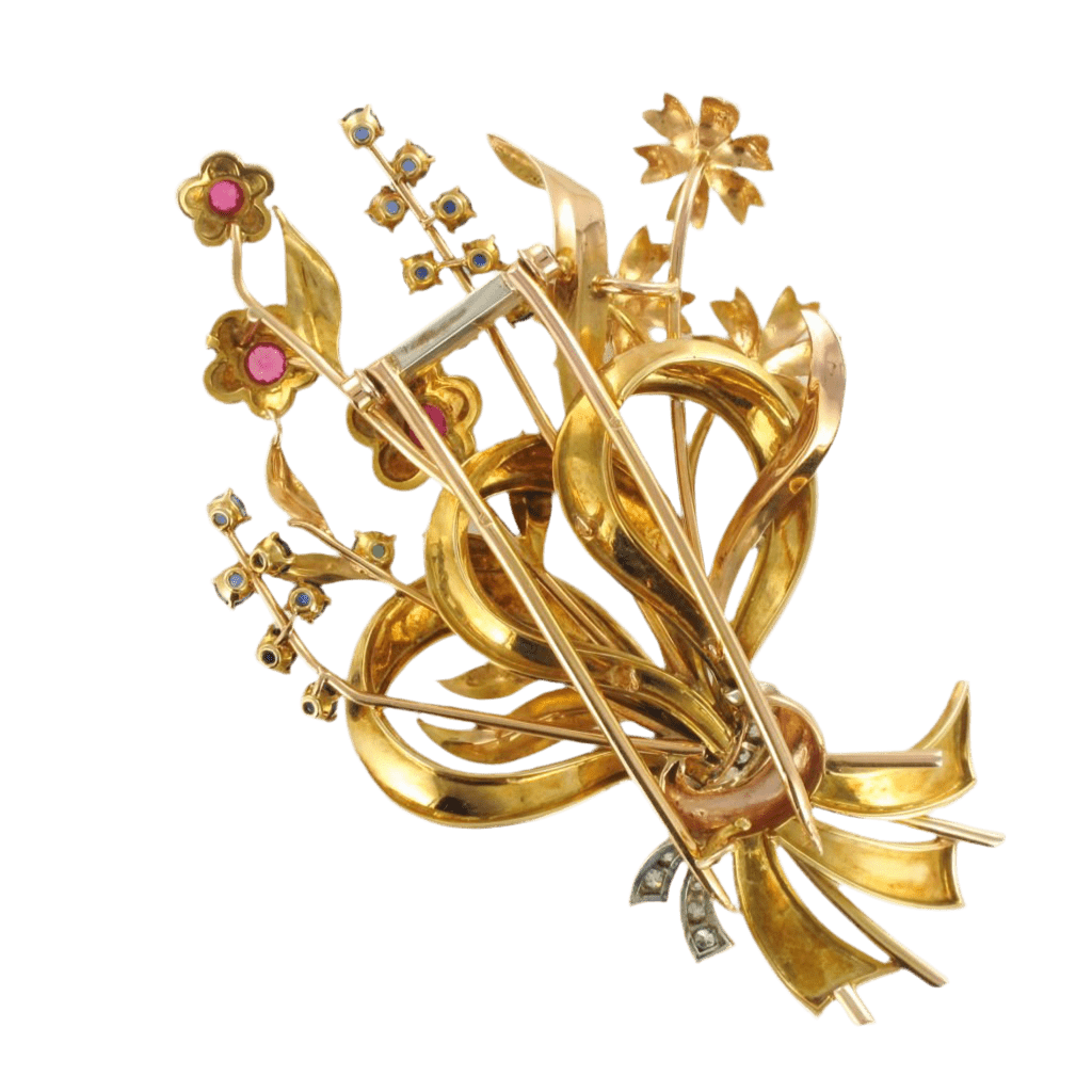 Broche Épingle en or jaune, rubis, saphirs et émeraude - Castafiore