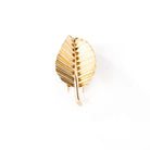 Broche feuille MAUBOUSSIN en or jaune. - Castafiore