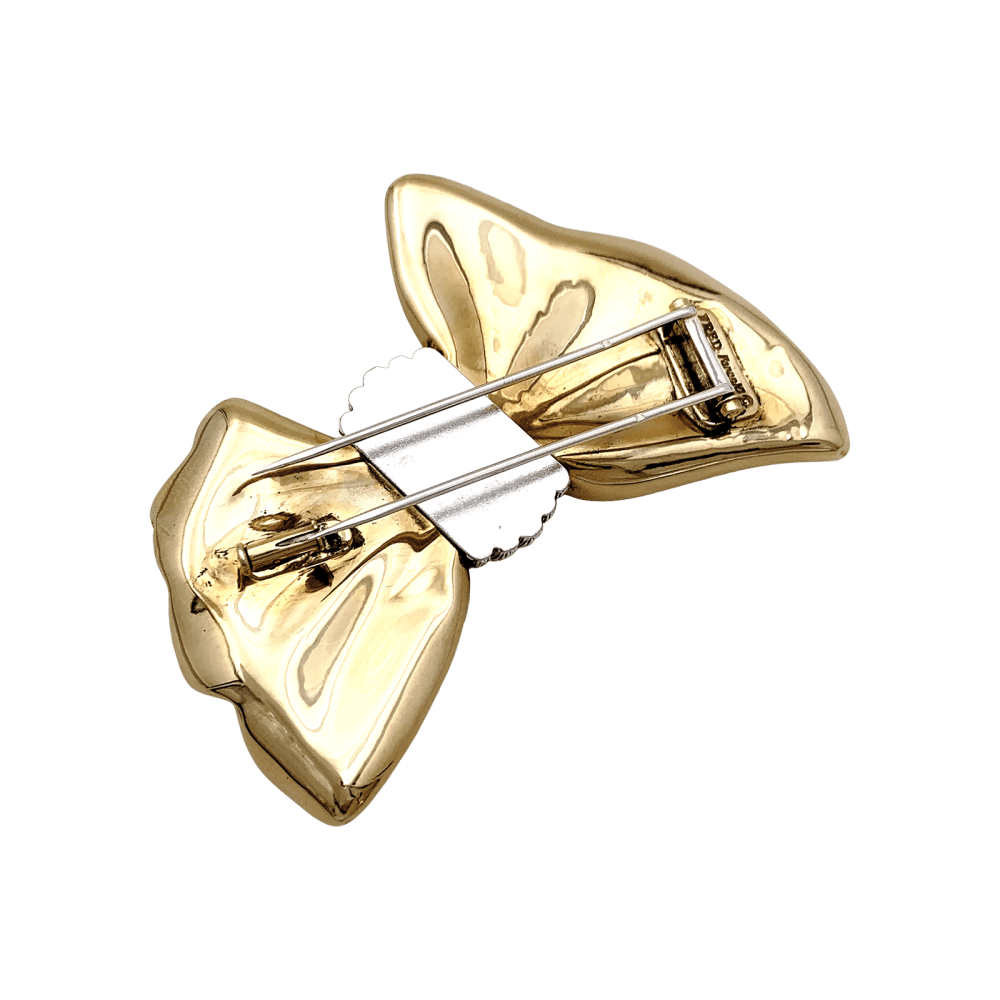 Brooch Fred, "Nœud", yellow gold and steel.