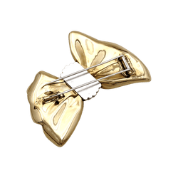 Brooch Fred, "Nœud", yellow gold and steel.