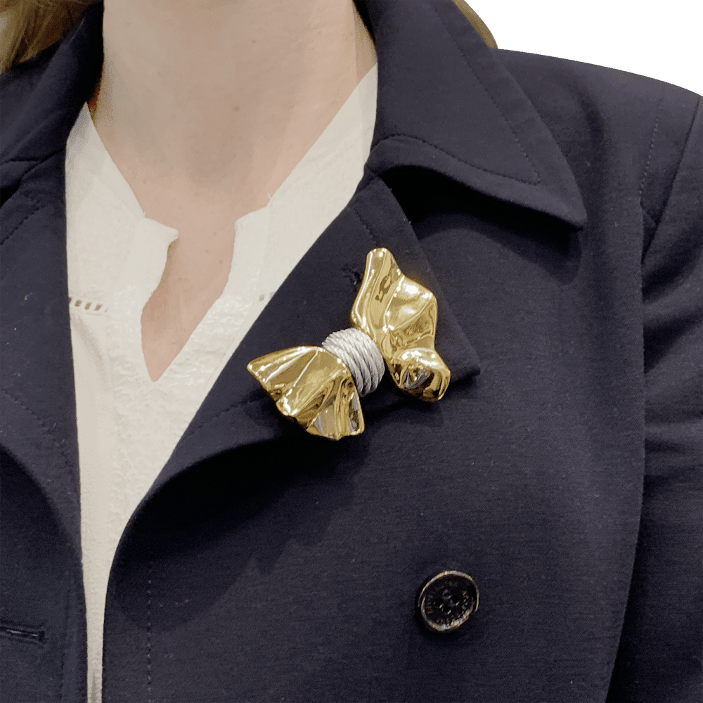 Brooch Fred, "Nœud", yellow gold and steel.