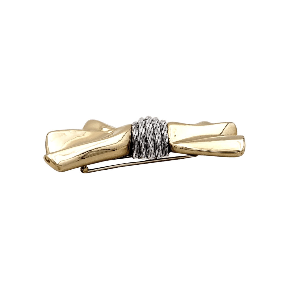 Brooch Fred, "Nœud", yellow gold and steel.