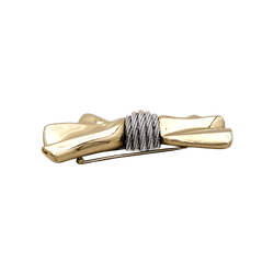 Brooch Fred, "Nœud", yellow gold and steel.