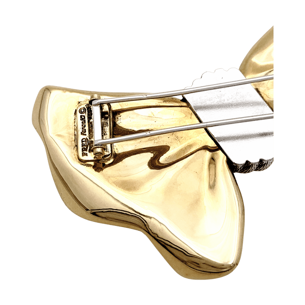 Brooch Fred, "Nœud", yellow gold and steel.