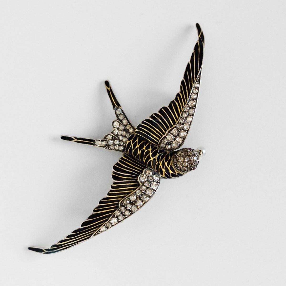 Broche "hirondelle" en or jaune et argent - Castafiore