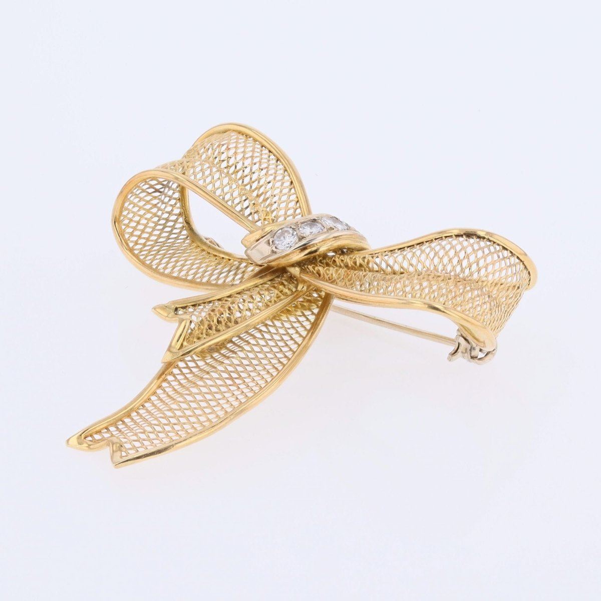 Brooch gold bow and diamonds