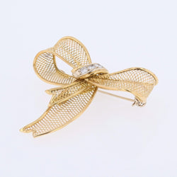 Brooch gold bow and diamonds