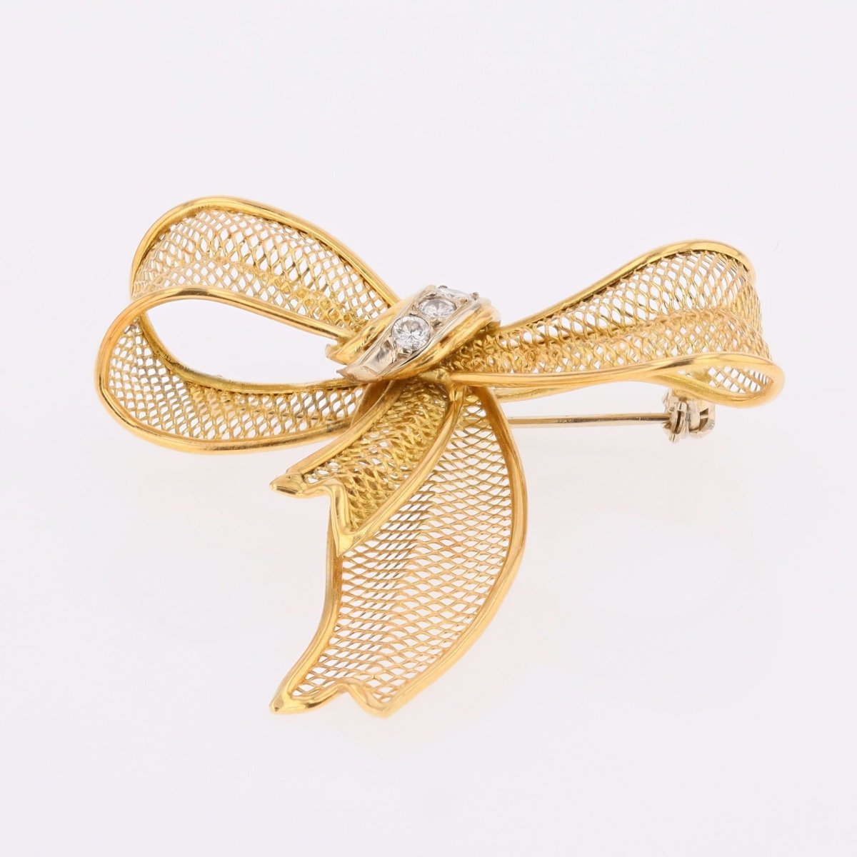Brooch gold bow and diamonds