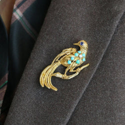 Broche oiseau en or jaune, saphir et diamant - Castafiore