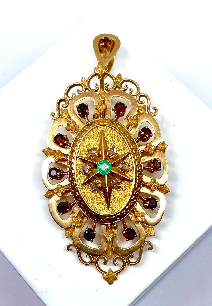 Broche pendentif en or jaune 18 carats en grenats, émeraude et diamants - Castafiore