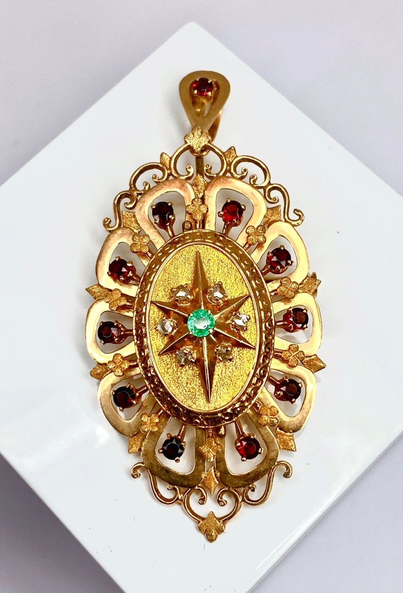 Broche pendentif en or jaune 18 carats en grenats, émeraude et diamants - Castafiore