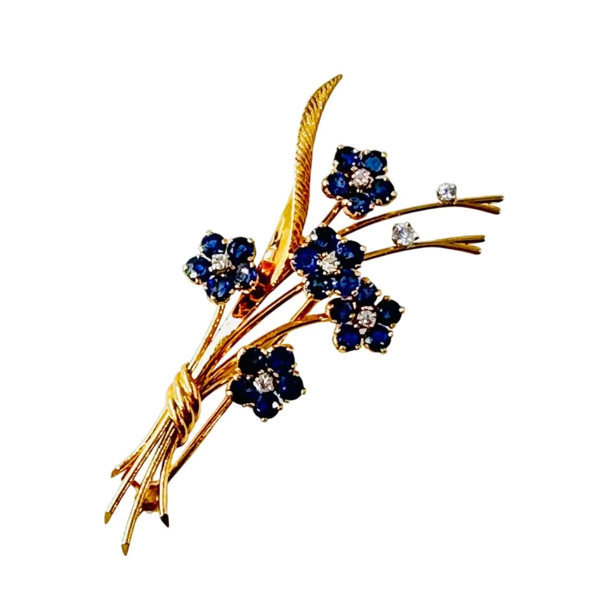 Broche VAN CLEEF & ARPELS "Bouquet Hawaï" en or jaune, platine, saphirs et diamants - Castafiore
