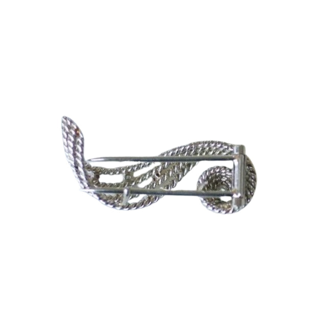 Broche volute diamants et rubis - Castafiore