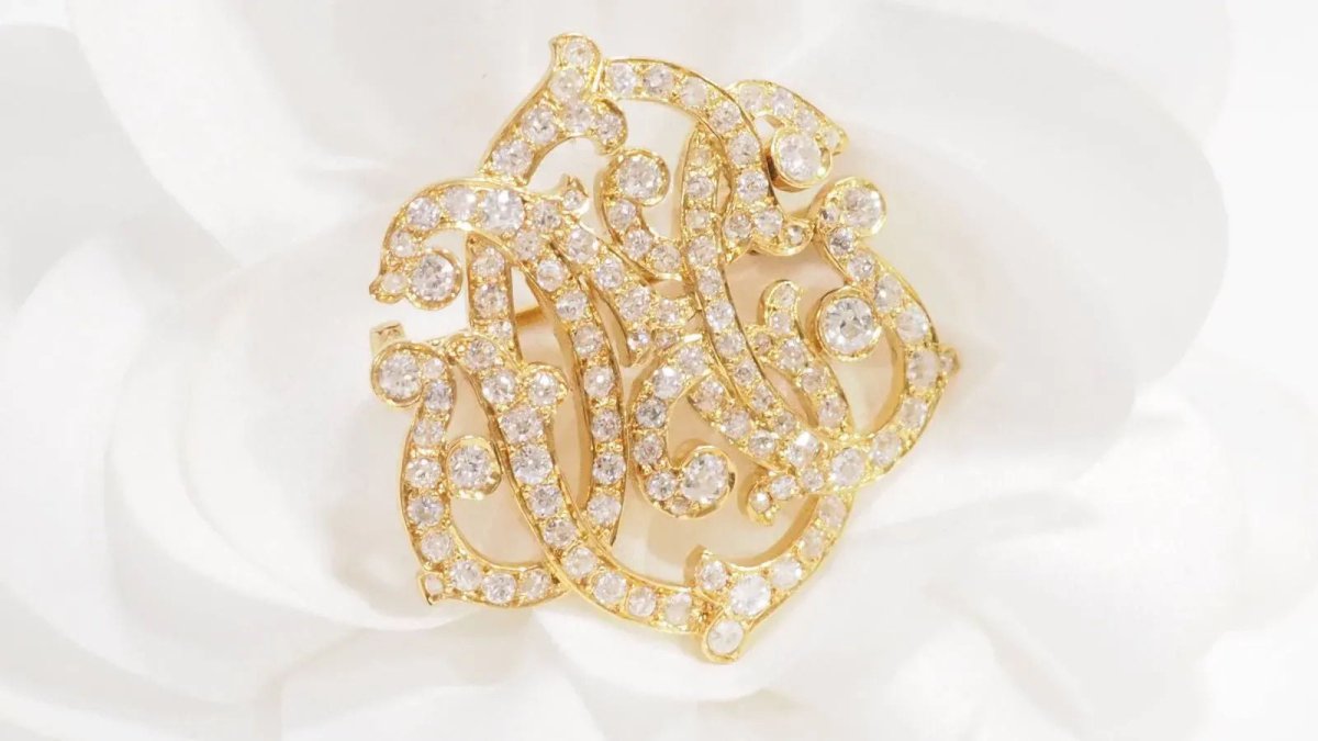 Broche volutes Art Nouveau en or jaune et diamants - Castafiore