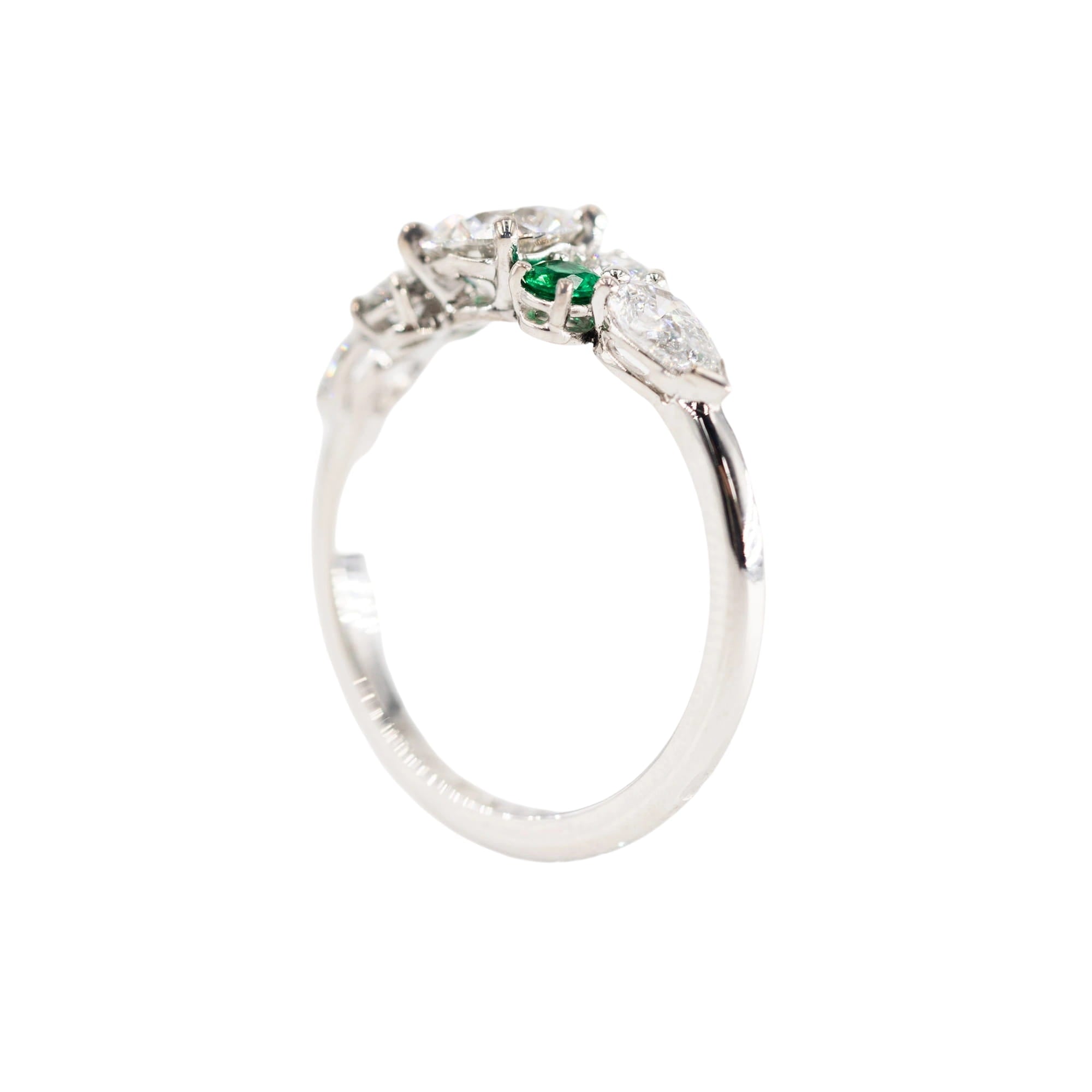 Entourage Ring in white gold, emeralds, and diamonds