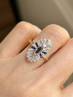 Entourage Ring in yellow gold, platinum, sapphire, and diamonds