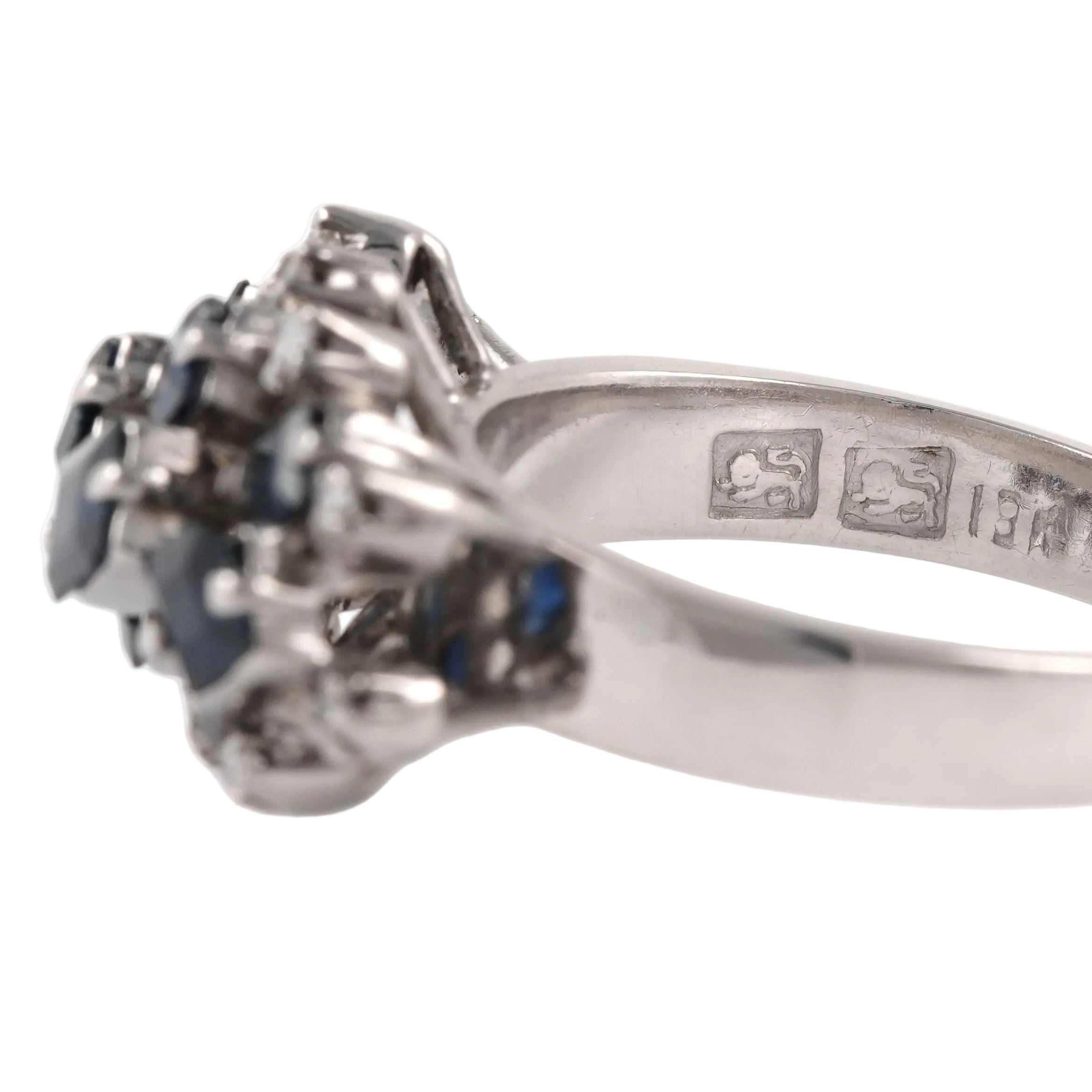 White gold ring with sapphires and diamonds