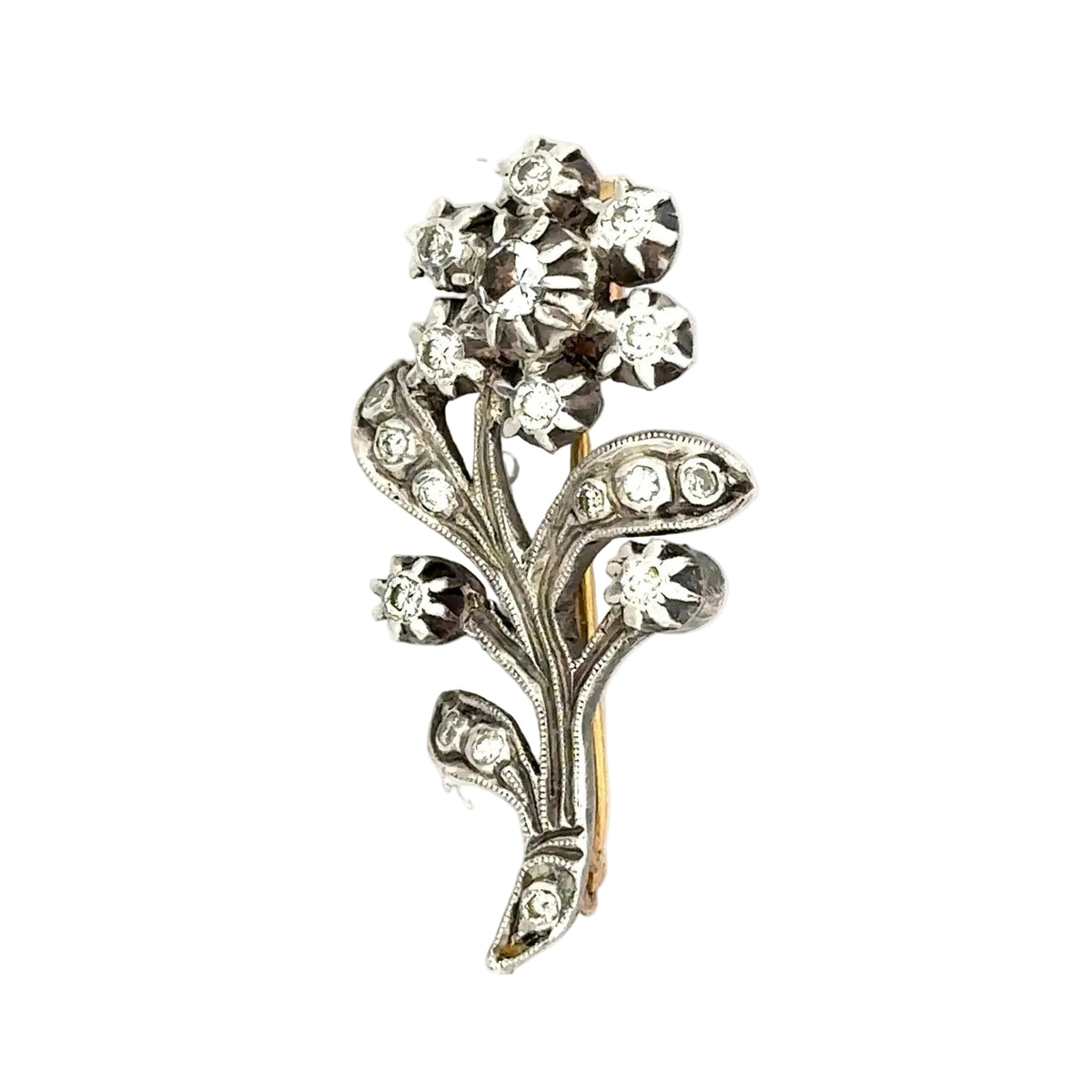 Brooch made of yellow gold, silver, sapphires, and diamonds