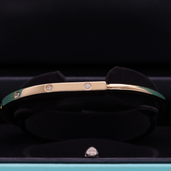 TIFFANY & CO. "Lock" Yellow Gold and Diamond Bangle