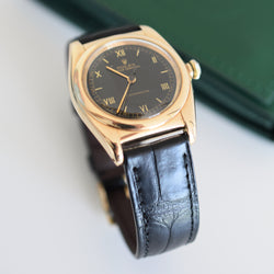 ROLEX "Oyster Perpetual Bubbleback Ovetto" watch in yellow gold and leather