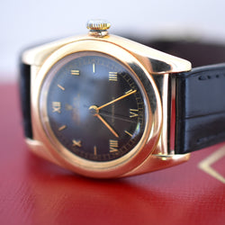 ROLEX "Oyster Perpetual Bubbleback Ovetto" watch in yellow gold and leather