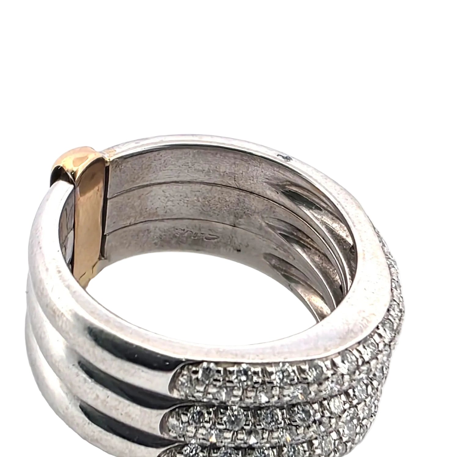 Ring Paved in white gold, yellow gold and diamonds.