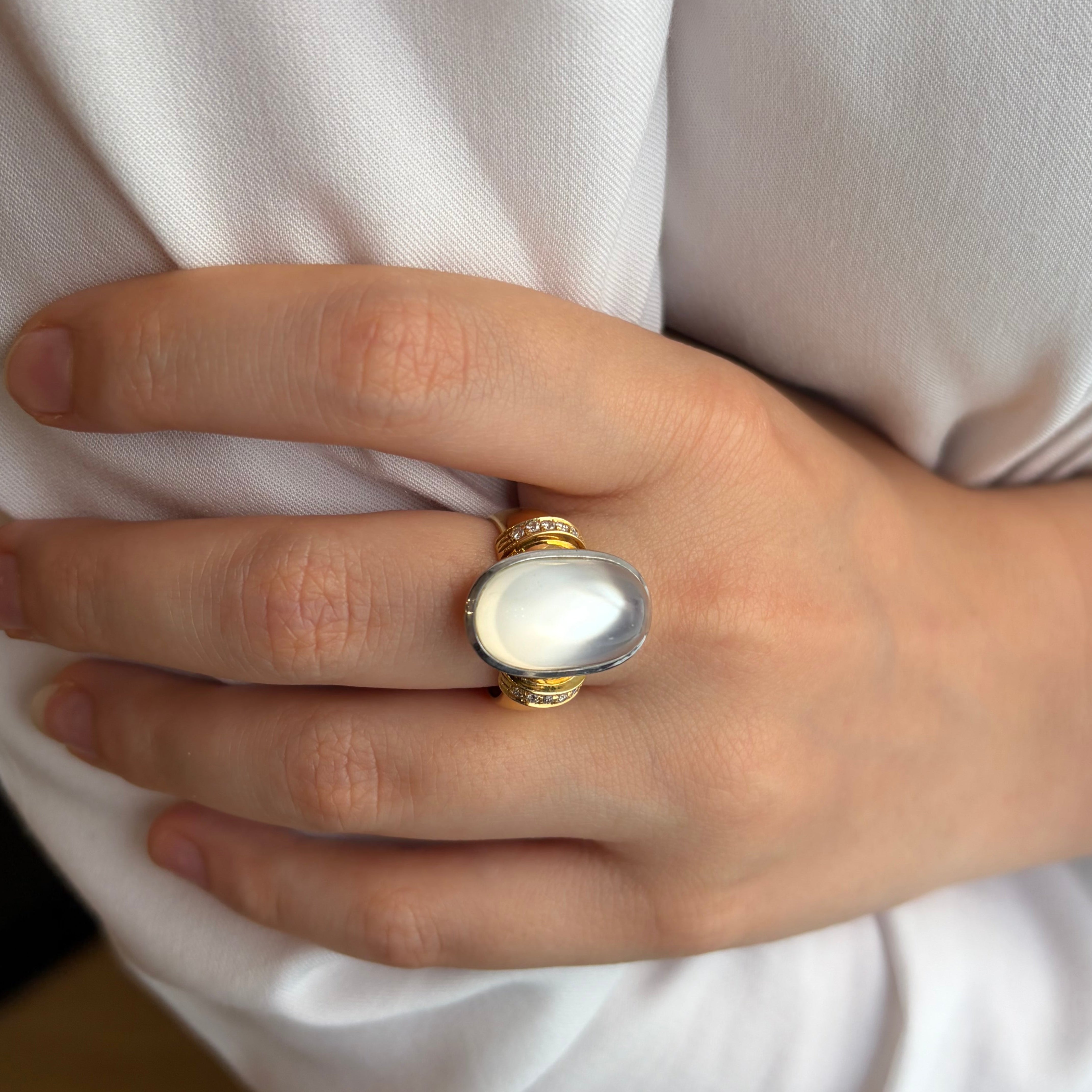 Solitaire Ring in yellow gold, white gold, moonstone, and diamonds