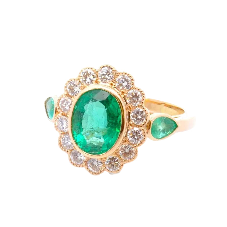 Entourage Ring in yellow gold, emeralds, and diamonds