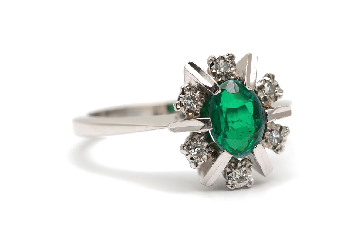 "Entourage" Ring in White Gold, Emerald, and Diamonds