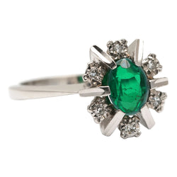 "Entourage" Ring in White Gold, Emerald, and Diamonds