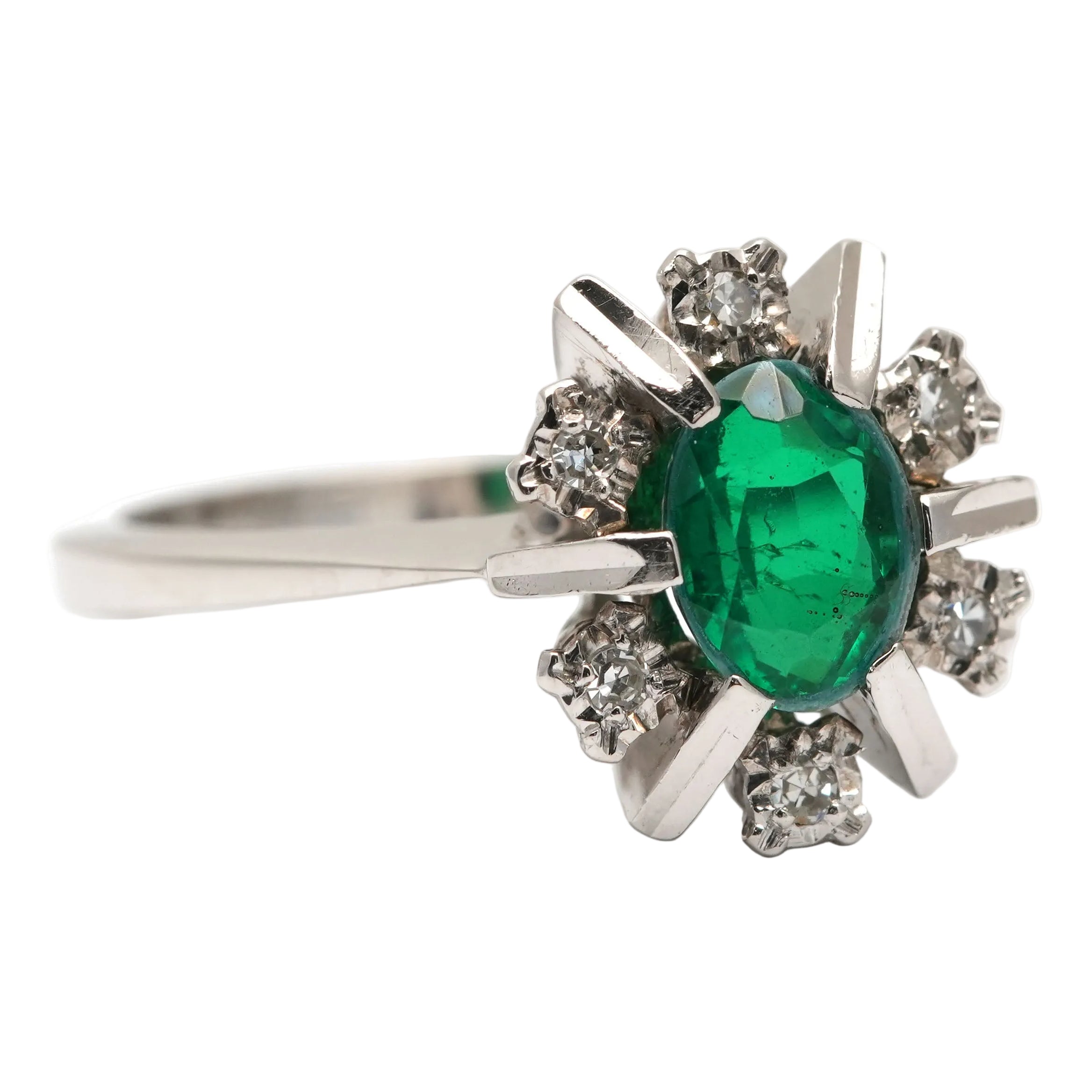 "Entourage" Ring in White Gold, Emerald, and Diamonds