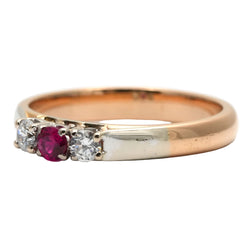 Trilogy Ring in white gold, yellow gold, rubies, and diamonds