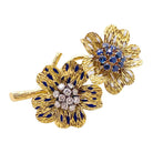 Clip BOUCHERON "Fleurs", or jaune, émaux, diamants et saphirs - Castafiore