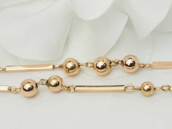 Collier boules en or rosé - Castafiore
