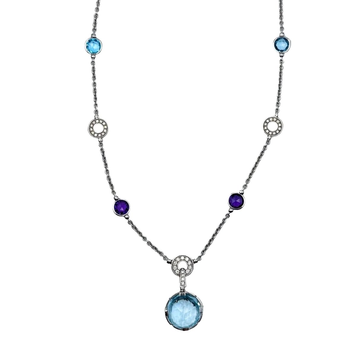 Collier BVLGARI "Parentesi Cocktail" en or blanc, topazes bleues, améthystes et diamants - Castafiore