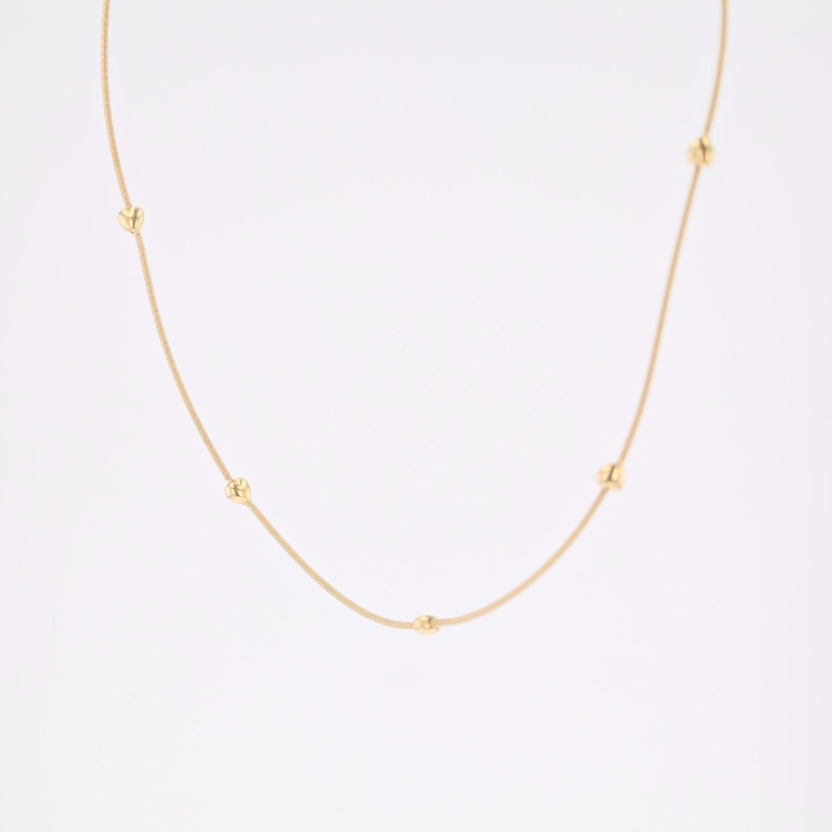 Necklace yellow gold cable and its little golden hearts