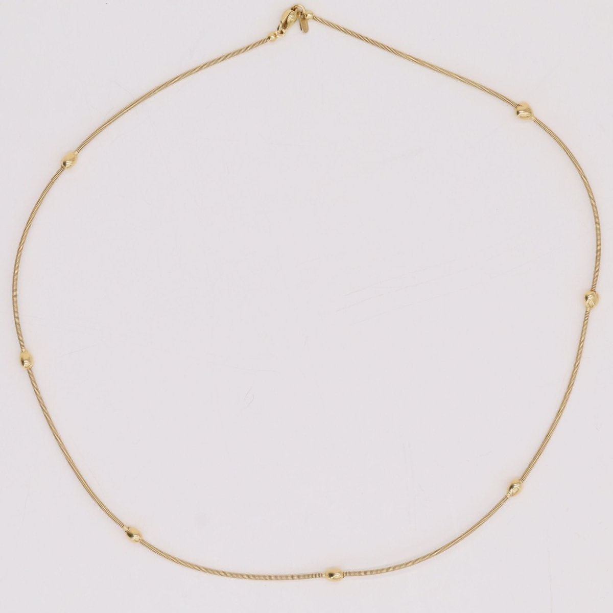 Necklace yellow gold cable and its little golden hearts