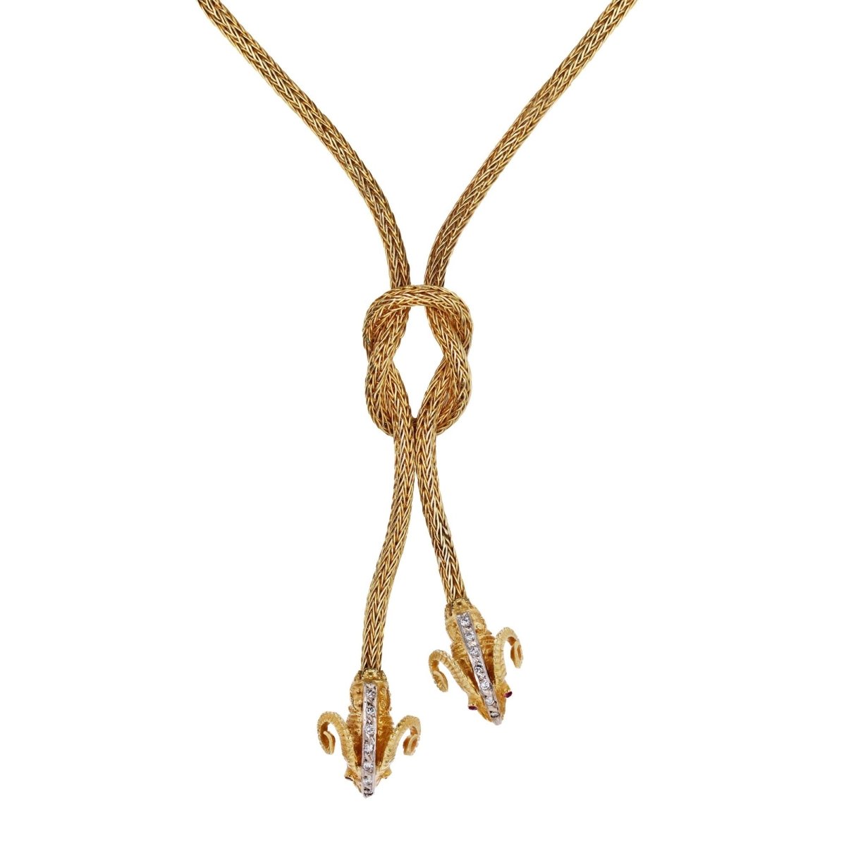 Necklace in braided gold with ram's head motifs diamonds and rubies