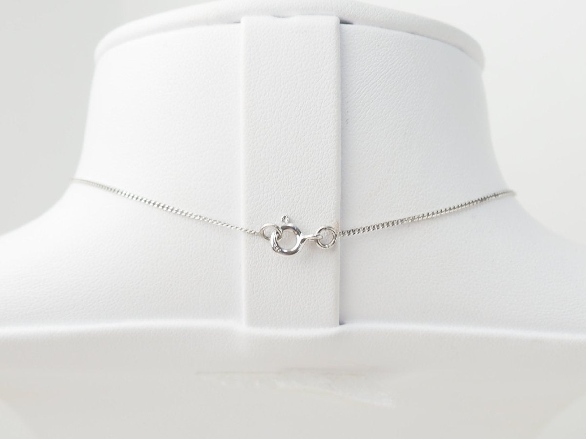 collier croix en or blanc et diamants - Castafiore