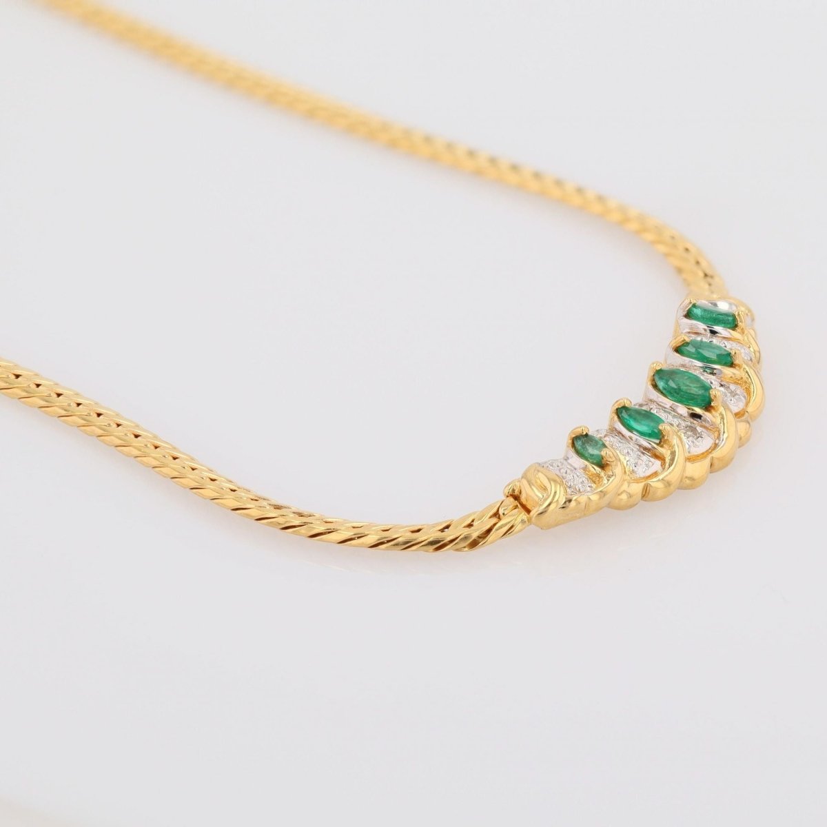 Collier maille gourmette en or jaune et émeraude - Castafiore