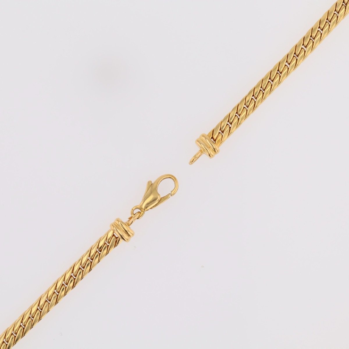 Collier maille gourmette en or jaune et émeraude - Castafiore