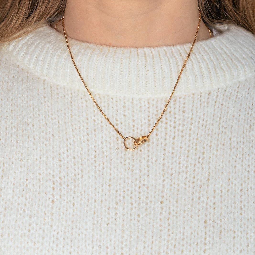 Collier Pendentif CARTIER "Love" en or rose et diamants - Castafiore