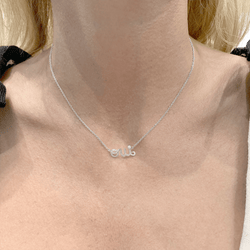 Collier Pendentif DIOR "Dioramour" en or blanc et diamants - Castafiore