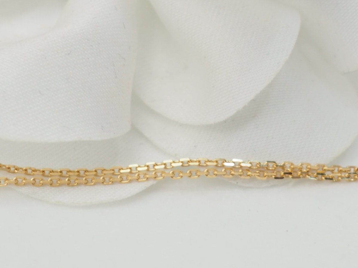 Collier pendentif marguerite en or jaune et grenats - Castafiore