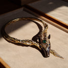 Collier Torque CHAUMET "Filly Princess" en or jaune, bronze, émeraude, saphirs et diamants - Castafiore