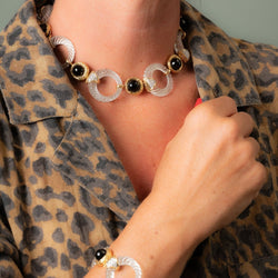 Collier transformable BOUCHERON en or jaune, onyx, cristal de roche et diamants - Castafiore