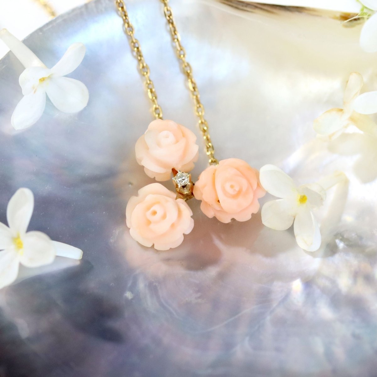 Necklace trio of angel-skin coral roses and diamond yellow gold